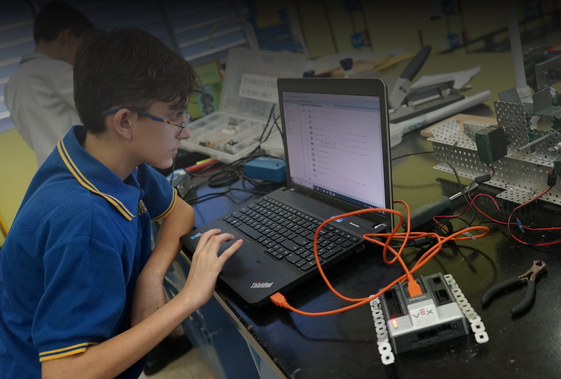 Robotics student using computer